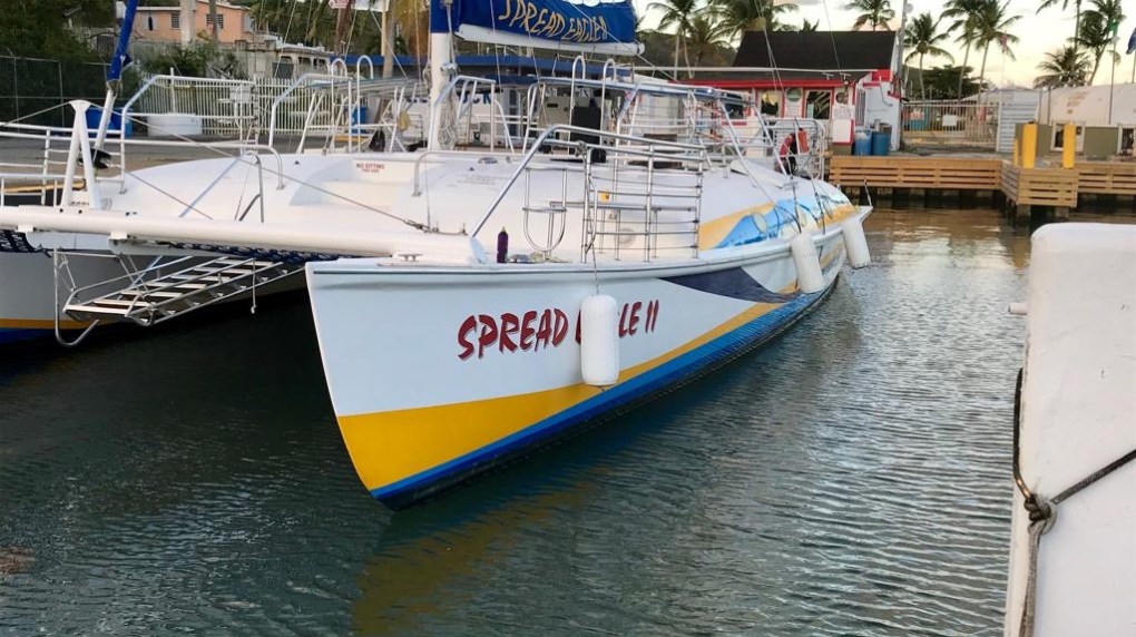 a boat is docked next to a body of water