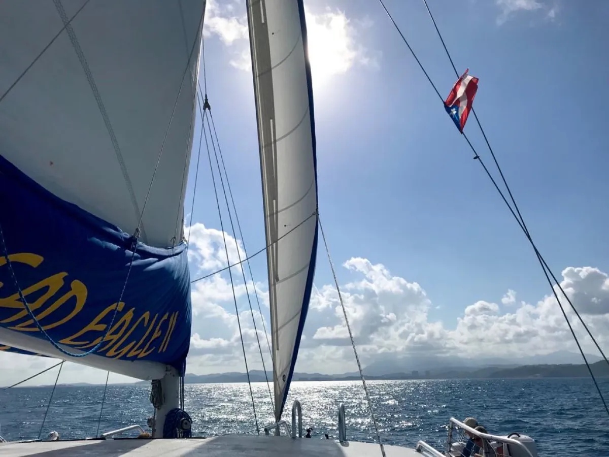 a group of people on a boat in the water